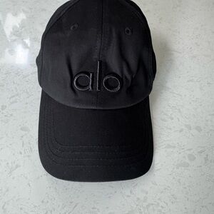 Alo Black “Off Duty” hat. NWOT